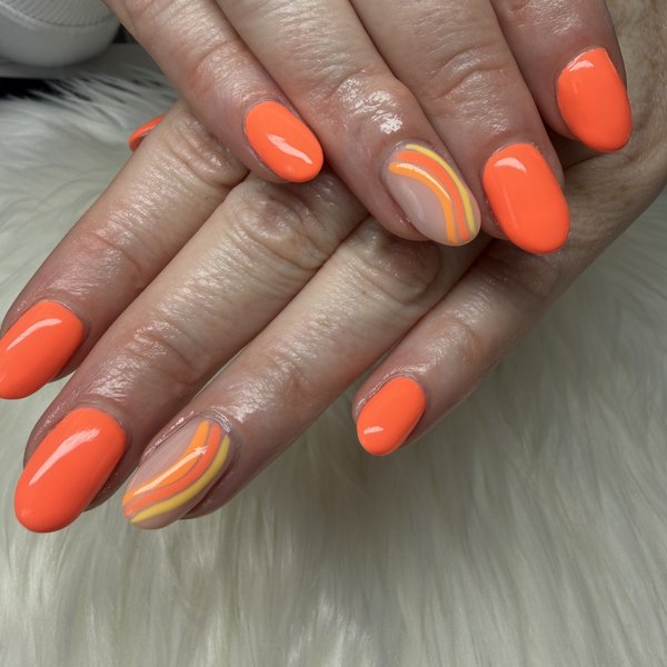 An orange BIAB manicure with hand-painted wave nail art by TLC Nails and Esthetics in Nottingham, MD