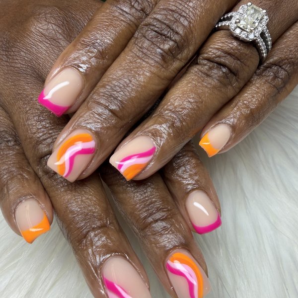 A nude BIAB manicure with hot pink and orange French tips and swirl nail art by TLC Nails and Esthetics in Nottingham, MD