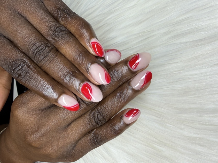 Nude BIAB nails with hand-painted red swirl line art by TLC Nails and Esthetics in Nottingham, MD