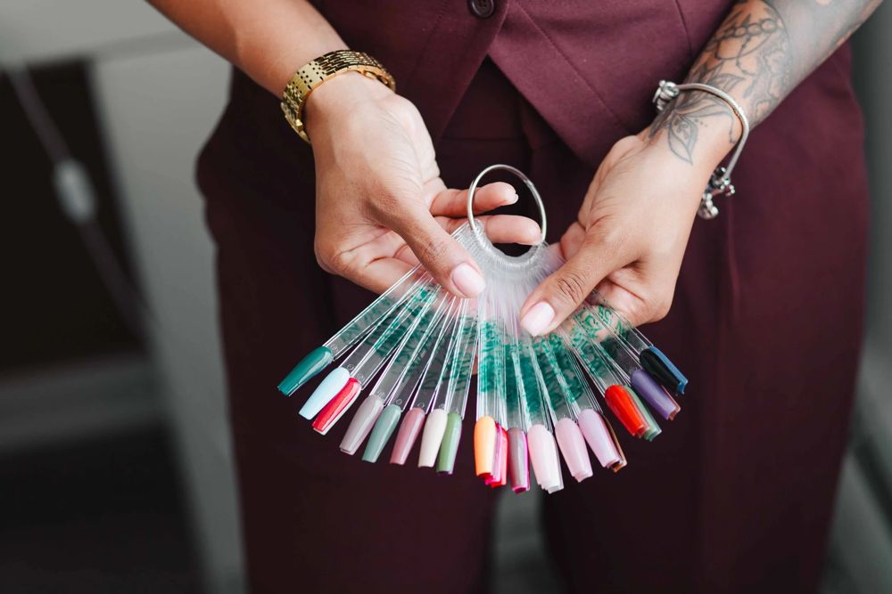 A fan of gel polish color swatch tips used to pick a Gel X design at TLC Nails and Esthetics in Nottingham, MD