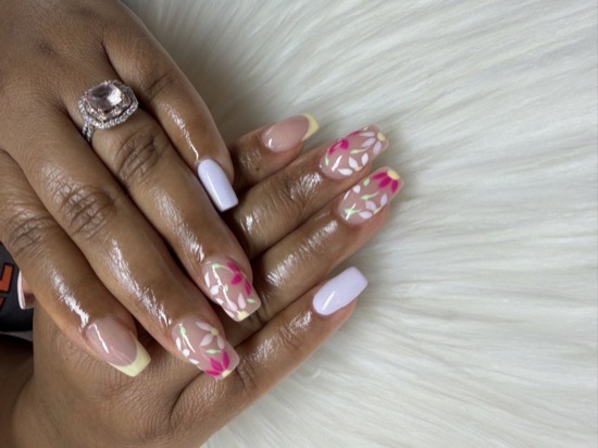 A nude Hard Gel set with hand-painted pink floral accent nails by TLC Nails and Esthetics in Nottingham, MD