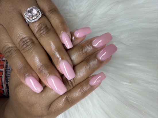 A long soft pink coffin-shaped Hard Gel manicure by TLC Nails and Esthetics in Nottingham, MD