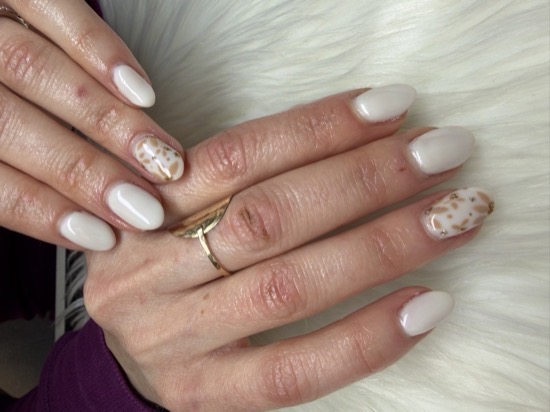 A cream Hard Gel set with a tortoiseshell gold-fleck accent nail by TLC Nails and Esthetics in Nottingham, MD
